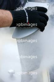 16.07.2006 Magny Cours, France,  McLaren mechanic preparing dry ice for the cooling of the cars on the grid - Formula 1 World Championship, Rd 11, French Grand Prix, Sunday