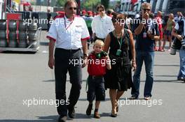 16.07.2006 Magny Cours, France,  Kees van de Grint (NED), Bridgestone Tyre Engineer, with his wide and son - Formula 1 World Championship, Rd 11, French Grand Prix, Sunday