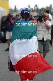 13.07.2006 Magny Cours, France,  Jarno Trulli (ITA), Toyota Racing, Portrait, with an Italian flag and a football World Champion T-shirt - Formula 1 World Championship, Rd 11, French Grand Prix, Thursday