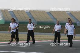 13.07.2006 Magny Cours, France,  Jenson Button (GBR), Honda Racing F1 Team, and Honda Racing team members walk round the circuit - Formula 1 World Championship, Rd 11, French Grand Prix, Thursday