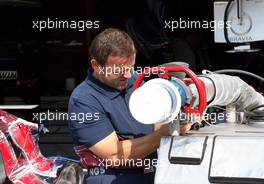 13.07.2006 Magny Cours, France,  Scuderia Toro Rosso team member prepares the fuel rigs - Formula 1 World Championship, Rd 11, French Grand Prix, Thursday