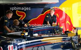 13.07.2006 Magny Cours, France,  Red Bull Racing mechanics prepare their cars for the weekend - Formula 1 World Championship, Rd 11, French Grand Prix, Thursday