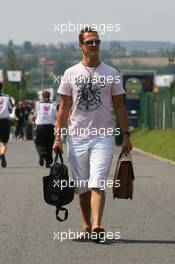 13.07.2006 Magny Cours, France,  Michael Schumacher (GER), Scuderia Ferrari arrives at the circuit - Formula 1 World Championship, Rd 11, French Grand Prix, Thursday