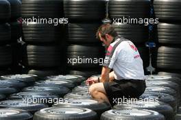 13.07.2006 Magny Cours, France,  Honda Racing tyre engineer preparing the tyres - Formula 1 World Championship, Rd 11, French Grand Prix, Thursday