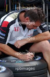 13.07.2006 Magny Cours, France,  Honda Racing tyre engineer marks the tyres - Formula 1 World Championship, Rd 11, French Grand Prix, Thursday