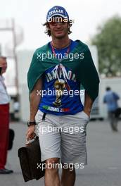 13.07.2006 Magny Cours, France,  Jarno Trulli (ITA), Toyota Racing, Portrait, with an Italian flag and a football World Champion T-shirt - Formula 1 World Championship, Rd 11, French Grand Prix, Thursday