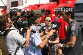 13.07.2006 Magny Cours, France,  Pedro de la Rosa (ESP), McLaren Mercedes, is interviewed by the Media - Formula 1 World Championship, Rd 11, French Grand Prix, Thursday