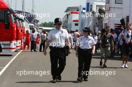 09.06.2006 Silverstone, England,  Police in the paddock - Formula 1 World Championship, Rd 8, British Grand Prix, Friday