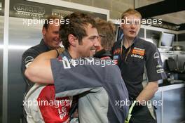 10.06.2006 Silverstone, England,  Tiago Monteiro (POR), Midland MF1 Racing receives congratulations from Johnny Herbert (GBR), Midland MF1 Racing, Sporting Relations Manager,after he went through to QF2 - Formula 1 World Championship, Rd 8, British Grand Prix, Saturday Qualifying