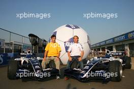 08.06.2006 Silverstone, England,  Mark Webber (AUS), Williams F1 Team with Nico Rosberg (GER), WilliamsF1 Team getting into the world cup spirit with a giant football - Formula 1 World Championship, Rd 8, British Grand Prix, Thursday