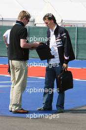 08.06.2006 Silverstone, England, Robert Kubica (POL), Test Driver, BMW Sauber F1 Team, signs an autograph for a fan - Formula 1 World Championship, Rd 8, British Grand Prix, Thursday