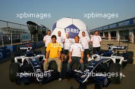 08.06.2006 Silverstone, England,  Mark Webber (AUS), Williams F1 Team with Nico Rosberg (GER), WilliamsF1 Team and some Williams mechanics getting into the world cup spirit with a giant football - Formula 1 World Championship, Rd 8, British Grand Prix, Thursday