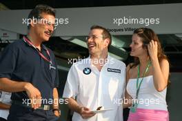 08.06.2006 Silverstone, England,  Dr. Mario Theissen (GER), BMW Sauber F1 Team, BMW Motorsport Director with Jacques Villeneuve (CDN), BMW Sauber F1 Team and his new wife Johanna - Formula 1 World Championship, Rd 8, British Grand Prix, Thursday