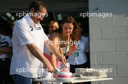 08.06.2006 Silverstone, England,  Jacques Villeneuve (CDN), BMW Sauber F1 Team with his new wife Johanna cutting a cake from BMW Sauber - Formula 1 World Championship, Rd 8, British Grand Prix, Thursday