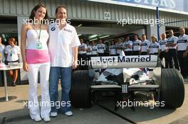 08.06.2006 Silverstone, England,  Jacques Villeneuve (CDN), BMW Sauber F1 Team with his new wife Johanna, BMW Sauber have put "Just Married" on the rear of Jacques Villeneuve's car to celebrate his marrage with his new wife Johanna - Formula 1 World Championship, Rd 8, British Grand Prix, Thursday