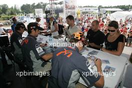 28.07.2006 Hockenheim, Germany,  Autograph session, Christijan Albers (NED), Midland MF1 Racing, Tiago Monteiro (POR), Midland MF1 Racing, Markus Winkelhock (GER), Test Driver, Midland MF1 Racing - Formula 1 World Championship, Rd 12, German Grand Prix, Friday
