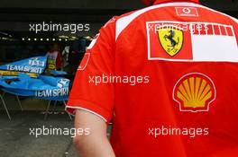 28.07.2006 Hockenheim, Germany,  Scuderia Ferrari, team member keeps a close eye on Renault - Formula 1 World Championship, Rd 12, German Grand Prix, Friday Practice