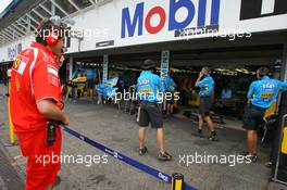 28.07.2006 Hockenheim, Germany,  Scuderia Ferrari, team member keeps a close eye on Renault - Formula 1 World Championship, Rd 12, German Grand Prix, Friday Practice