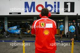 28.07.2006 Hockenheim, Germany,  Scuderia Ferrari, team member keeps a close eye on Renault - Formula 1 World Championship, Rd 12, German Grand Prix, Friday Practice