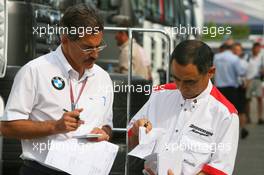 28.07.2006 Hockenheim, Germany,  Hiroshi Yasukawa (JPN), Bridgestone with Dr. Mario Theissen (GER), BMW Sauber F1 Team, BMW Motorsport Director - Formula 1 World Championship, Rd 12, German Grand Prix, Friday
