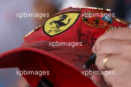 28.07.2006 Hockenheim, Germany,  A Ferrari hat with autographs - Formula 1 World Championship, Rd 12, German Grand Prix, Friday