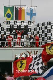 30.07.2006 Hockenheim, Germany,  2ns place Felipe Massa (BRA), Scuderia Ferrari with 1st place Michael Schumacher (GER), Scuderia Ferrari, 3rd place Kimi Raikkonen (FIN), Räikkönen, McLaren Mercedes and Paolo Martinelli (ITA), Scuderia Ferrari, Engine development - Formula 1 World Championship, Rd 12, German Grand Prix, Sunday Podium