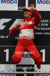 30.07.2006 Hockenheim, Germany,  1st place Michael Schumacher (GER), Scuderia Ferrari jumps in the air - Formula 1 World Championship, Rd 12, German Grand Prix, Sunday Podium