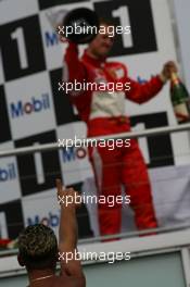 30.07.2006 Hockenheim, Germany,  A race fan gives Michael Schumacher (GER), Scuderia Ferrari the thumns up - Formula 1 World Championship, Rd 12, German Grand Prix, Sunday Podium