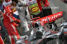30.07.2006 Hockenheim, Germany,  Michael Schumacher (GER), Scuderia Ferrari 1st place looks at Kimi Raikkonen's McLaren - Formula 1 World Championship, Rd 12, German Grand Prix, Sunday Podium