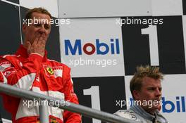 30.07.2006 Hockenheim, Germany,  Michael Schumacher (GER), Scuderia Ferrari 1st place and 3rd place Kimi Raikkonen (FIN), Räikkönen, McLaren Mercedes - Formula 1 World Championship, Rd 12, German Grand Prix, Sunday Podium