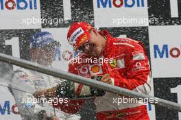 30.07.2006 Hockenheim, Germany,  3rd place Kimi Raikkonen (FIN), Räikkönen, McLaren Mercedes and Michael Schumacher (GER), Scuderia Ferrari 1st place - Formula 1 World Championship, Rd 12, German Grand Prix, Sunday Podium
