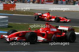 30.07.2006 Hockenheim, Germany,  Michael Schumacher (GER), Scuderia Ferrari 248 F1, leading Felipe Massa (BRA), Scuderia Ferrari 248 F1 - Formula 1 World Championship, Rd 12, German Grand Prix, Sunday Race