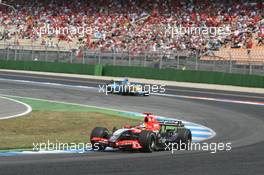 30.07.2006 Hockenheim, Germany,  Tiago Monteiro (POR), Midland MF1 Racing, Toyota M16 and Fernando Alonso (ESP), Renault F1 Team, R26 - Formula 1 World Championship, Rd 12, German Grand Prix, Sunday Race