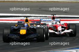 30.07.2006 Hockenheim, Germany,  Christian Klien (AUT), Red Bull Racing RB2, leads Jarno Trulli (ITA), Toyota Racing TF106 - Formula 1 World Championship, Rd 12, German Grand Prix, Sunday Race