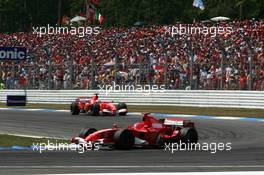 30.07.2006 Hockenheim, Germany,  Michael Schumacher (GER), Scuderia Ferrari 248 F1, leads Felipe Massa (BRA), Scuderia Ferrari 248 F1 - Formula 1 World Championship, Rd 12, German Grand Prix, Sunday Race