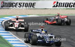 30.07.2006 Hockenheim, Germany,  Mark Webber (AUS), Williams F1 Team, FW8 Cosworth  and Rubens Barrichello (BRA), Honda Racing F1 Team, RA106 - Formula 1 World Championship, Rd 12, German Grand Prix, Sunday Race