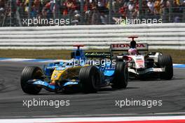 30.07.2006 Hockenheim, Germany,  Fernando Alonso (ESP), Renault F1 Team R26, leads Rubens Barrichello (BRA), Honda Racing F1 Team RA106 - Formula 1 World Championship, Rd 12, German Grand Prix, Sunday Race
