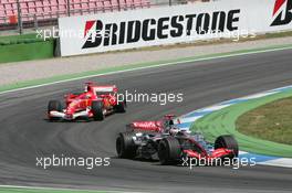 30.07.2006 Hockenheim, Germany,  Kimi Raikkonen (FIN), Räikkönen, McLaren Mercedes, MP4-21 and Michael Schumacher (GER), Scuderia Ferrari, 248 F1 - Formula 1 World Championship, Rd 12, German Grand Prix, Sunday Race