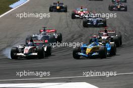 30.07.2006 Hockenheim, Germany,  Jenson Button (GBR), Honda Racing F1 Team RA106, outbreaking Fernando Alonso (ESP), Renault F1 Team R26, at the haripin at the first lap - Formula 1 World Championship, Rd 12, German Grand Prix, Sunday Race