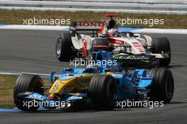 30.07.2006 Hockenheim, Germany,  Fernando Alonso (ESP), Renault F1 Team, R26 leads Rubens Barrichello (BRA), Honda Racing F1 Team, RA106  - Formula 1 World Championship, Rd 12, German Grand Prix, Sunday Race