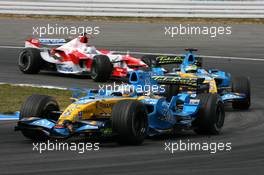 30.07.2006 Hockenheim, Germany,  Fernando Alonso (ESP), Renault F1 Team R26, leads Giancarlo Fisichella (ITA), Renault F1 Team R26 and Jarno Trulli (ITA), Toyota Racing TF106 - Formula 1 World Championship, Rd 12, German Grand Prix, Sunday Race