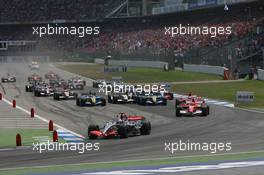 30.07.2006 Hockenheim, Germany,  Start, 1st Place, Kimi Raikkonen (FIN), Räikkönen, McLaren Mercedes, MP4-21, Michael Schumacher (GER), Scuderia Ferrari, 248 F1, Felipe Massa (BRA), Scuderia Ferrari, 248 F1 - Formula 1 World Championship, Rd 12, German Grand Prix, Sunday Race