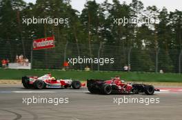 30.07.2006 Hockenheim, Germany,  Vitantonio Liuzzi (ITA), Scuderia Toro Rosso, STR01 and Ralf Schumacher (GER), Toyota Racing, TF106 - Formula 1 World Championship, Rd 12, German Grand Prix, Sunday Race