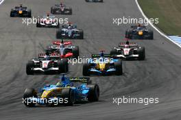 30.07.2006 Hockenheim, Germany,  Start of the race, with Giancarlo Fisichella (ITA), Renault F1 Team R26, in front of the Jenson Button (GBR), Honda Racing F1 Team RA106 and Fernando Alonso (ESP), Renault F1 Team R26, who are fighting for position - Formula 1 World Championship, Rd 12, German Grand Prix, Sunday Race
