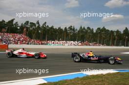 30.07.2006 Hockenheim, Germany,  Christian Klien (AUT), Red Bull Racing, RB2 and Jarno Trulli (ITA), Toyota Racing, TF106 - Formula 1 World Championship, Rd 12, German Grand Prix, Sunday Race