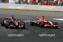 30.07.2006 Hockenheim, Germany,  Scott Speed (USA), Scuderia Toro Rosso STR 01 and Christijan Albers (NED), Midland F1 Racing M16, fighting for position - Formula 1 World Championship, Rd 12, German Grand Prix, Sunday Race