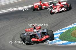 30.07.2006 Hockenheim, Germany,  Kimi Raikkonen (FIN), Räikkönen, McLaren Mercedes, P4-21  and Michael Schumacher (GER), Scuderia Ferrari, 248 F1 - Formula 1 World Championship, Rd 12, German Grand Prix, Sunday Race