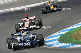 30.07.2006 Hockenheim, Germany,  Mark Webber (AUS), Williams F1 Team, FW28 Cosworth and Rubens Barrichello (BRA), Honda Racing F1 Team, RA106 - Formula 1 World Championship, Rd 12, German Grand Prix, Sunday Race