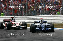 30.07.2006 Hockenheim, Germany,  Mark Webber (AUS), WilliamsF1 Team FW28, leads Rubens Barrichello (BRA), Honda Racing F1 Team RA106 - Formula 1 World Championship, Rd 12, German Grand Prix, Sunday Race