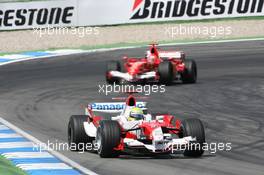 30.07.2006 Hockenheim, Germany,  Ralf Schumacher (GER), Toyota Racing, TF106 and Michael Schumacher (GER), Scuderia Ferrari, 248 F1  - Formula 1 World Championship, Rd 12, German Grand Prix, Sunday Race